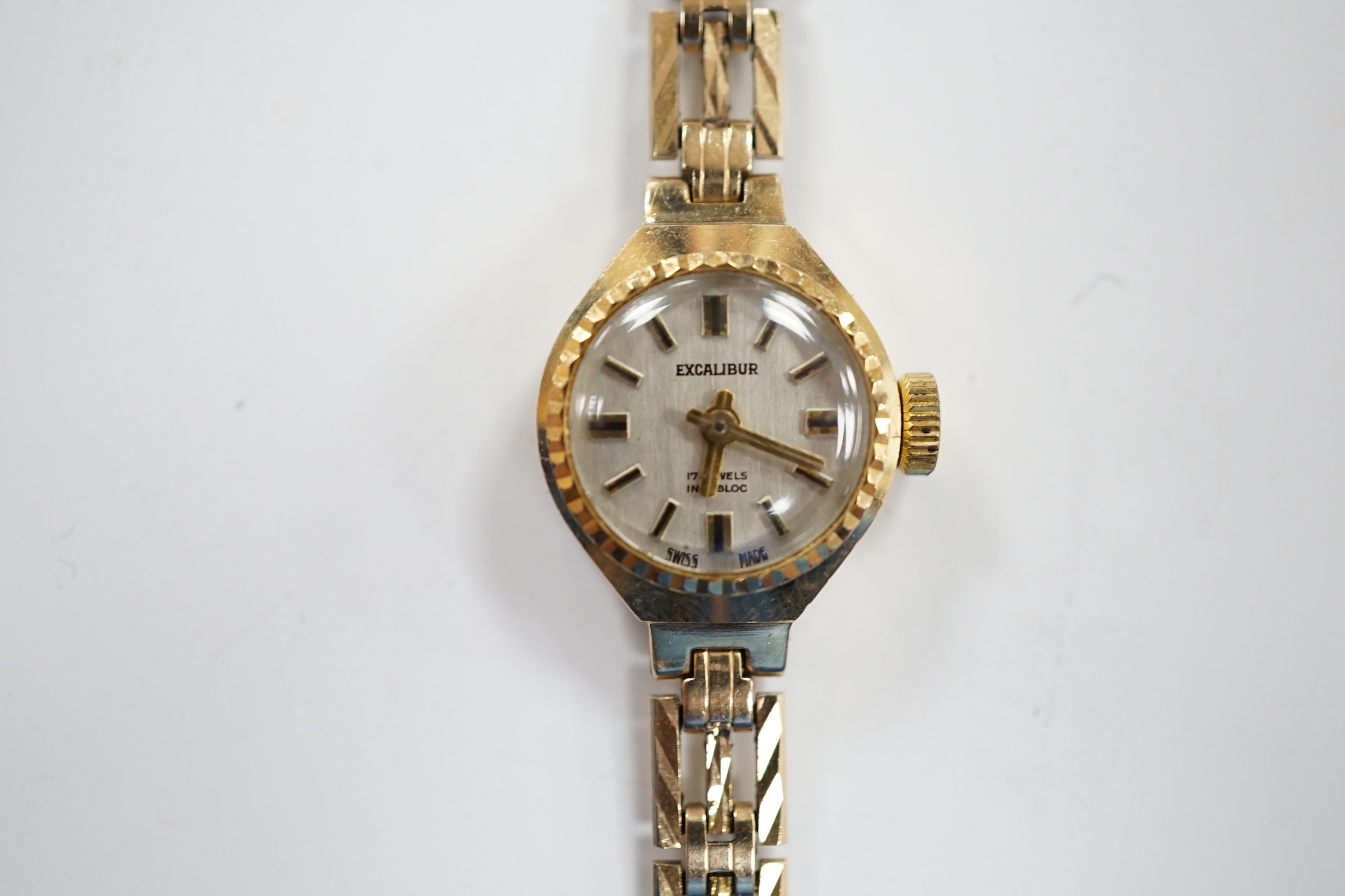 A lady's 9ct gold Excalibur manual wrist watch, on a 9ct gold bracelet, overall 17.5cm, gross weight 12 grams.